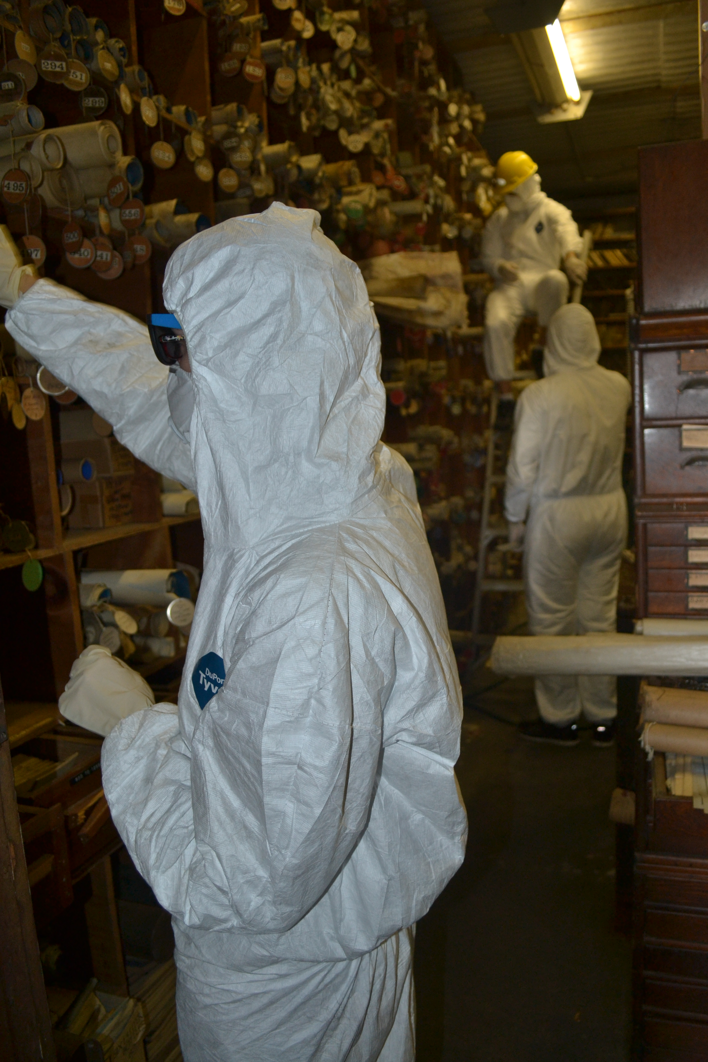 Chelsea Solotky wears hazmat gear during the retrieval of maps from the LCN vault in Coaldale, Pa.