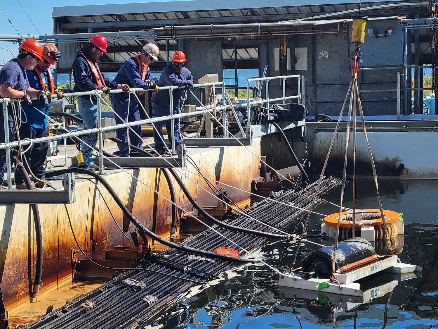 Lowering equipment into Ohmsett tank