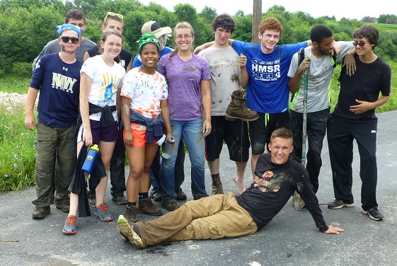 Students participated in a service project planting native trees in a riparian buffer zone