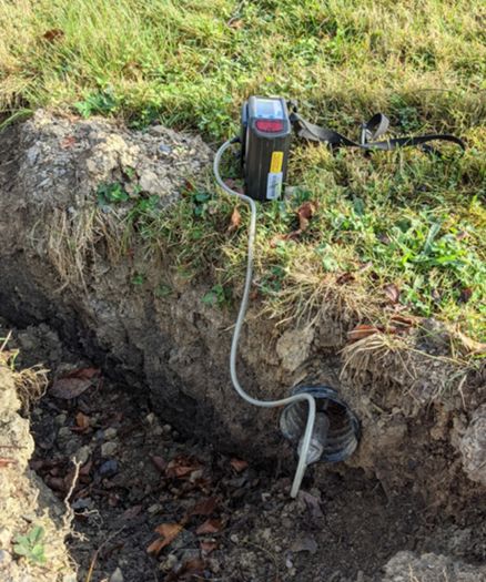 Gas meter seen in the ground checking pipe in McDonald, PA