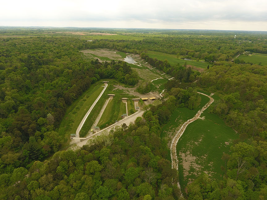 After reclamation: Eliminated dangerous highwall, introduced diverse plants, and installed access trail.