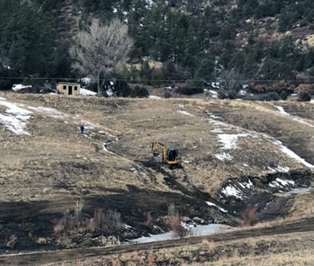 Working on upland erosion control structure in steep, frozen conditions. Photo courtesy of New Mexico Abandoned Mine Land Program.