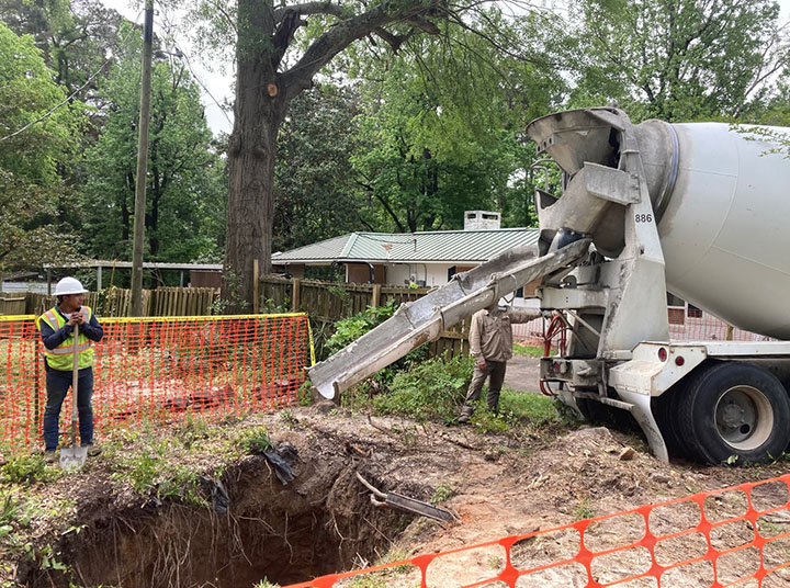 Truck pours concrete into sinkhole at AML Project TX000056