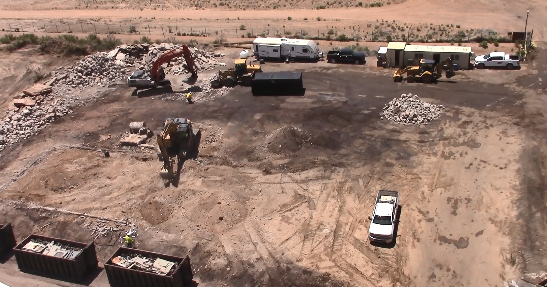 Photograph looking down on heavy machinery demolishing and removing the Black Mesa Preparation Plant buildings and facilities. 