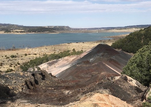 The West Sopris Coal Refuse Project before reclamation. The steep and heavily eroded waste piles were hazardous to walk on and sediment was being deposited in Trinidad Lake. Photo courtesy of Colorado Inactive Mine Reclamation Program.